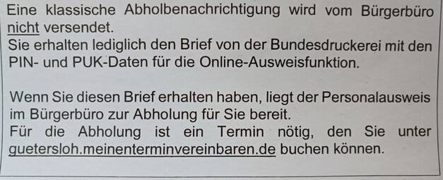 Foto eines Behördenpapiers zur PA-Abholung, welches auf "guetersloh.meinenterminvereinbaren.de" zur Terminvereinbarung verweist.